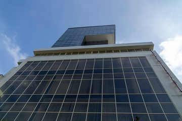 underside panoramic and perspective view to steel blue glass high rise building skyscrapers, business concept of successful industrial architecture
