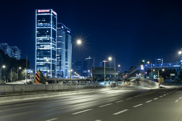 Empty Freeway At Night And Tel Aviv Skyline in Background
