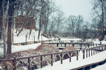 bridge over the river in park in winter in Kuldiga in Latvia