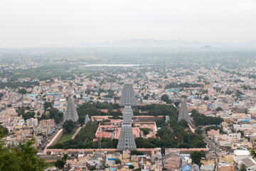 Naklejka premium Overall view of the Annamalaiyar temple from the Arunchalahill sacred mountain hiking on a summer day, Tiruvannamalai, Tamil Nadu, India 2019