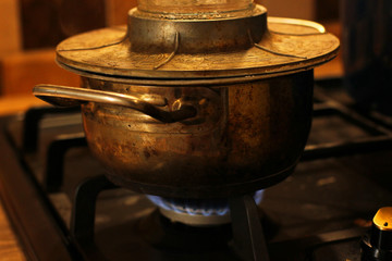 Old pan on a gas stove
