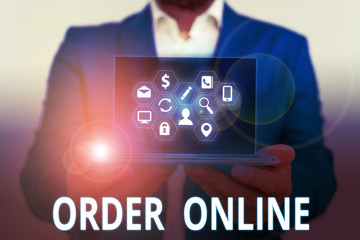 Conceptual hand writing showing Order Online. Concept meaning Buying goods and services from the...