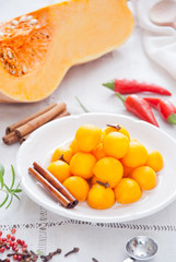 Homemade pickled organic pumpkin balls with spices