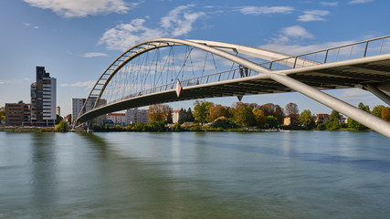 Low Angle View of Bridge Over River In City Against Sky
