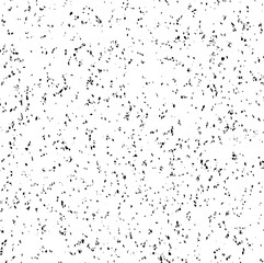 Small uneven spots and particles of debris. Abstract vector texture.  Distressed uneven background. Grunge texture overlay with fine grains isolated on white background. Vector illustration. EPS10.