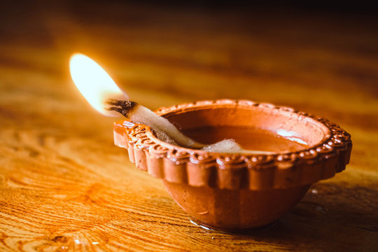 Diwali festival lamp on wooden background
