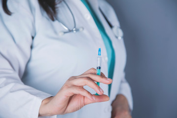 woman doctor hand syringe
