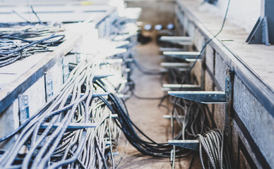 Fototapeta premium Cable tunnel with cables in the power substation