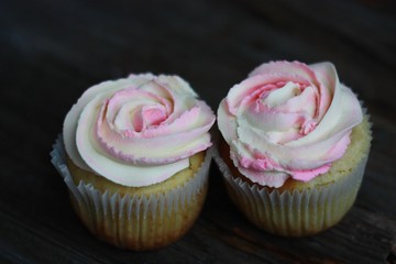 Delicious cupcakes with cream on the table