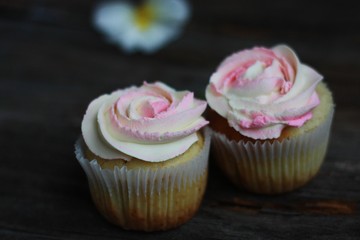 Delicious cupcakes with cream on the table