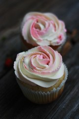 Delicious cupcakes with cream on the table