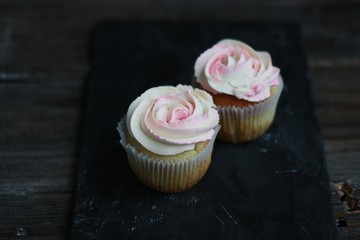 Delicious cupcakes with cream on the table