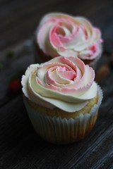 Delicious cupcakes with cream on the table