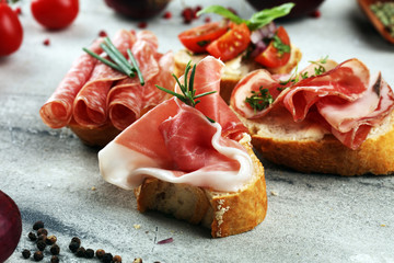 Assorted bruschetta with various toppings. Appetizing bruschetta or crudo crostini. Variety of...