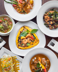 Authentic Thai food. Grilled mango shrimp, lamb larb, tom yum soup, and fried sweet and spicy chicken. Spicy, pungent, and flavorful ethnic Thai food. 