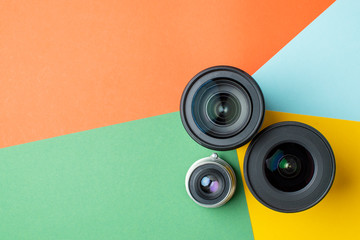 three photo lenses, on a colored background, a set of photo devices for the camera