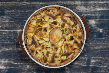 Homemade organic pear pie dessert ready to eat. Pear tart on the old wooden background, close up