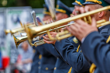  Music instrument played by saxophonist player and band musicians on stage in fest, at a concert musician playing his instrument,tuba brass instrument, wind classical musician .
