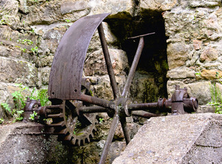 old machine parts remind of the existence of the old water mill at Dolny Mlyn in Bohemian...