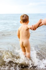 naked boy in the beach