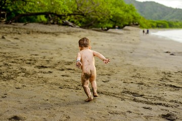 naked boy in the beach