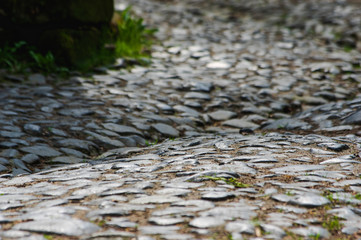 close up of ancient historic cobble stone paved street near Dolny Mlyn in Bohemian Switzerland national park
