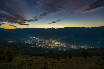 Panorama of the evening city among the mountains
