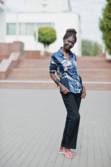 Young black female posed in the city. African women single portrait.