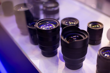 lenses stand vertically in the window. soft focus side view
