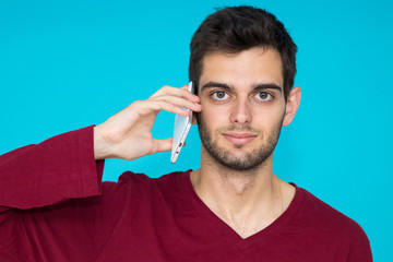 man with smartphone or mobile phone isolated on color background