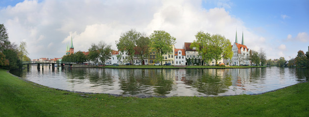 Old town of Luebeck, wide panoramic view of the historic city at the river Trave in Germany, copy...