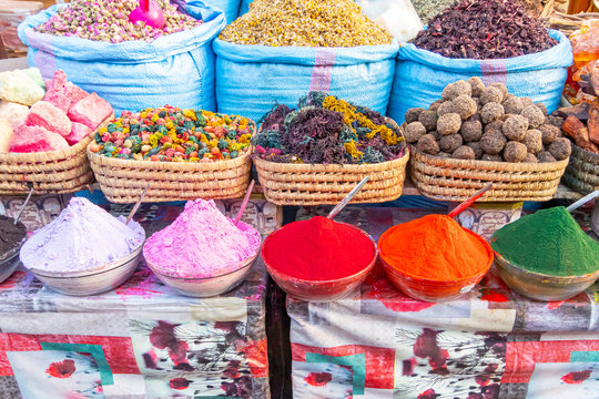 Blue bags with aromatic herbs and colored dyes in the Marrakech market