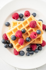 Waffles with blueberries and raspberries.