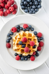 Waffles with blueberries and raspberries.