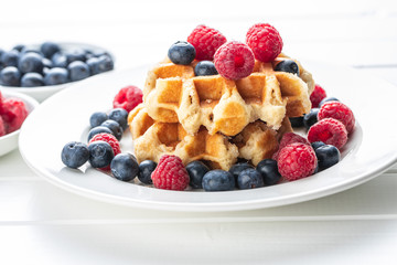 Waffles with blueberries and raspberries.