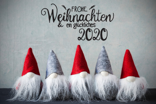 Five Santa Claus With Hat. Concrete Background With German Calligraphy Frohe Weihnachten Und Ein Glueckliches 2020 Means Merry Christmas And A Happy 2020