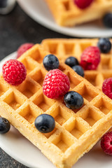 Waffles with blueberries and raspberries.