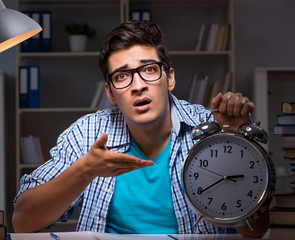 The student preparing for exams late night at home