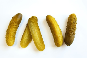 Pickled cucumbers on a white background