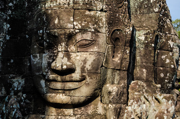 Fototapeta na wymiar Ancient stone faces of Asian culture, in abandoned temples - Angkor Wat