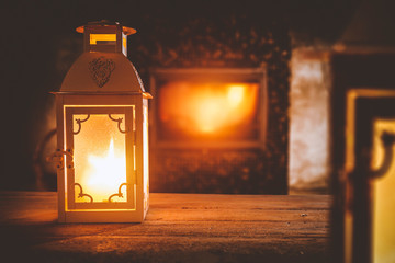 Wooden top with cosy warm home interior with fireplace background.