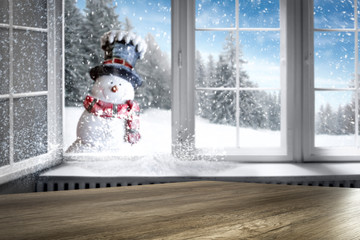 Snowy winter outside the window background with space on wooden board top for products and...