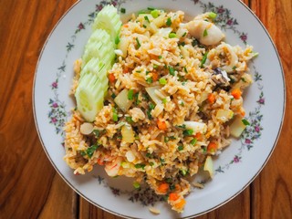 Thai food fried rice egg with cucumber carrot shrimp Sliced spring onion in dish yummy for healthy. 