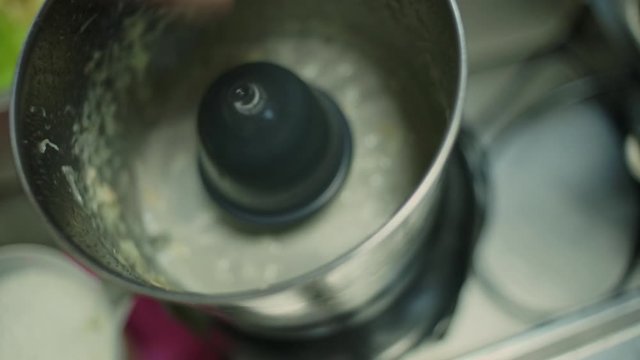 Closeup of cook using a squeezer