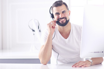 Businessman in the office on the phone with headset, Skype