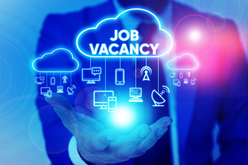 Handwriting text Job Vacancy. Conceptual photo empty or available paid place in small or big company Male human wear formal work suit presenting presentation using smart device