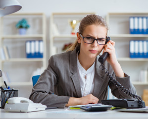 Young businesswoman accountant working in the office