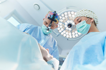Man surgeon at work in operating room