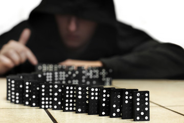 Guy and dominoes. Domino game