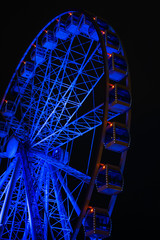 Photo of ferris wheel against background of night sky